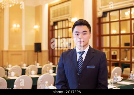 young man in modern dining room Stock Photo