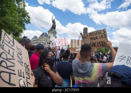 Paris, France. 13th June, 2020. Protesters hold signs during a Black Lives Matter protest at Place de la Republique in Paris, France, on June 13th, 2020. (Photo by Daniel Brown/Sipa USA) Credit: Sipa USA/Alamy Live News Stock Photo