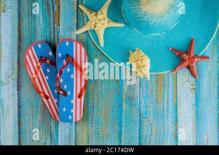 Summer holiday with seashells, starfish, sand frame on wooden board Stock Photo