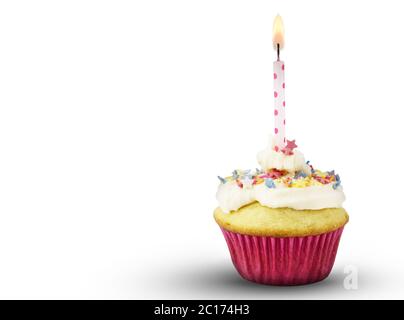 Single cup cake with lit pink spotted candle isolated on white background Stock Photo