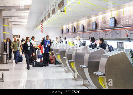 Miami Florida International Airport MIA,aviation,American Airlines,carrier,global company,ticket counter,Hispanic Black African Africans,man men male, Stock Photo