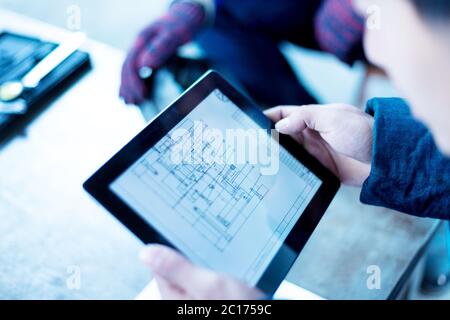young worker working in factory Stock Photo