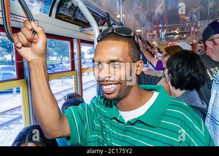 New Orleans Louisiana,Regional Transit Authority,RTA,Riverfront Streetcar Line,tram,trolley,Black man men male adult adults,passenger passengers rider Stock Photo
