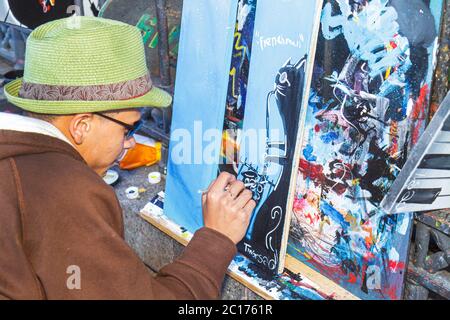 New Orleans Louisiana,French Quarter,Decatur Street,Jackson Squarefence,artist colony,vendor vendors,stall stalls booth market buyer buying selling,ar Stock Photo