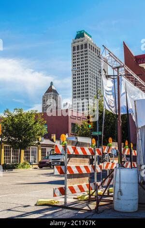 05-21 Tulsa USA - Event road closure near downtown Tulsa with stoplight and safety barriers and Art Deco skyscrapers Stock Photo