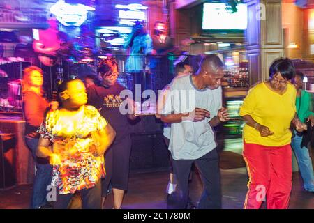 New Orleans Louisiana,French Quarter,Bourbon Street,bar lounge pub,club,live music,entertainment,night eveningclub,musician,stage,perform,Black man me Stock Photo