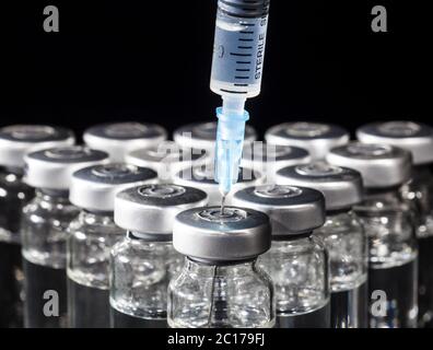 Glass Medicine Vials and Syringe Stock Photo