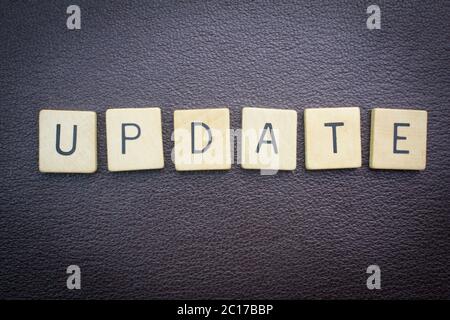 Update word concept for website on dark leather background Stock Photo