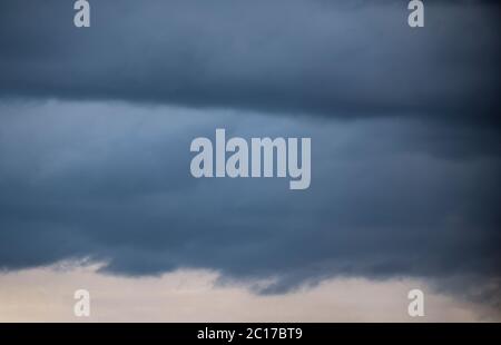 Heavy storm clouds form layers in the sky over Worcestershire, UK. Stock Photo