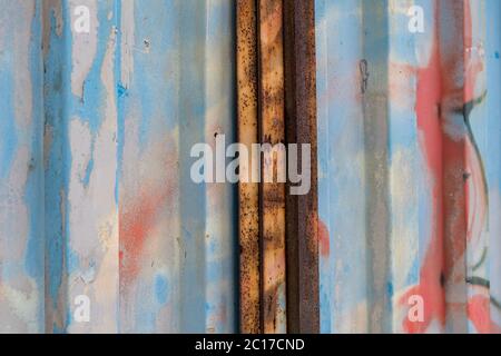 Close up shot of colorful rusty garage door Stock Photo