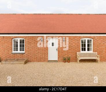 Single storey (story) new build house or granny annexe (annex), part of a UK home extension Stock Photo