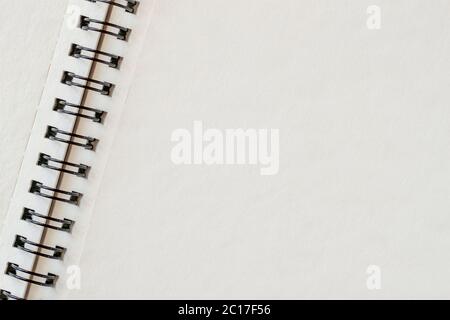 Spiral bound notepad, open blank, clean page, empty space, background with copy space Stock Photo