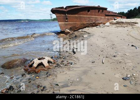 rusty ship on the shore of  Ob river in Russia Stock Photo