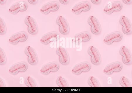 Pattern of cute pink fluffy sleep mask on pink drop. Sleep management and optimization, beauty sleep, beauty and sleep log concept. Place for text Stock Photo