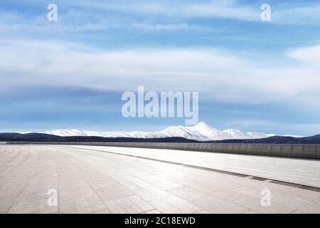 empty marble floor with snow mountains Stock Photo