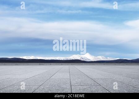 empty marble floor with snow mountains Stock Photo