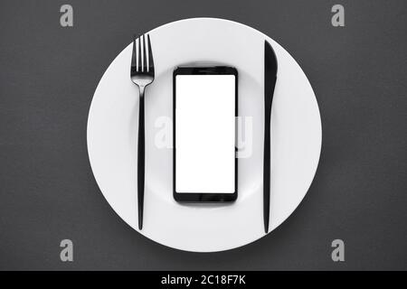 Smart phone mock up screen on white plate black background as food delivery app. Stock Photo