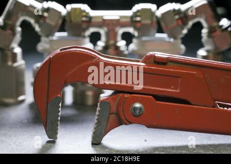 adjust wrench power grip and elements of water and gas shutoff valves Stock Photo