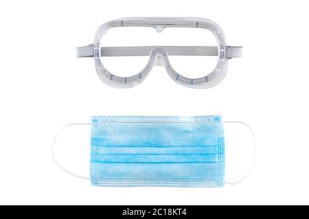 Blue medical face mask and transparent protective glasses isolated on white background. Stock Photo