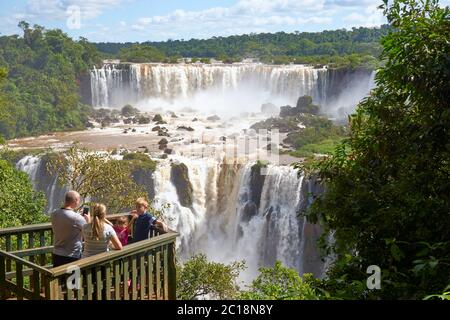 A family taking a photo at Iguazu of Brazil side Stock Photo