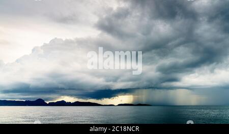 Rain storm and low clouds over the Andaman Sea off Krabi coast in Thailand Stock Photo