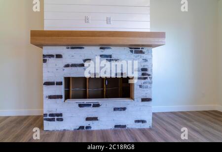 Black and white bricks fireplace in living room Stock Photo