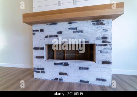 Decorative fireplace in empty living room interior Stock Photo