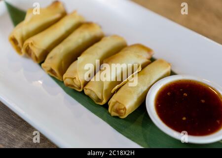 Fried chinese spring rolls with sweet chili sauce. Stock Photo