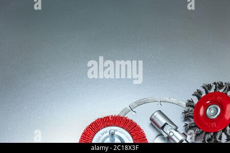 circular wire brush disks with studded diamond blade on gray metallic background Stock Photo
