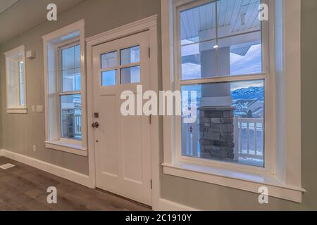 View from inside past a front door with windows Stock Photo