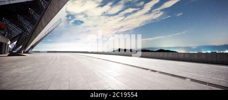 empty marble floor with green hill in star sky Stock Photo