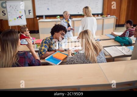 Students discussing while having lecture in amphitheater Stock Photo