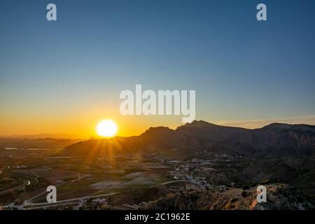 View to the mountains and the center of Orihuela, Spain during sunset Stock Photo