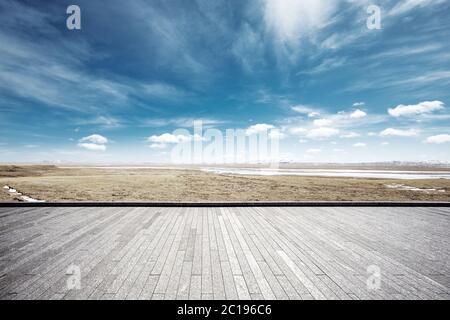 empty brick floor with snow mountains Stock Photo
