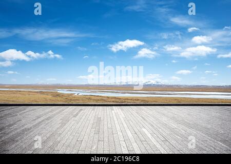 empty brick floor with snow mountains Stock Photo