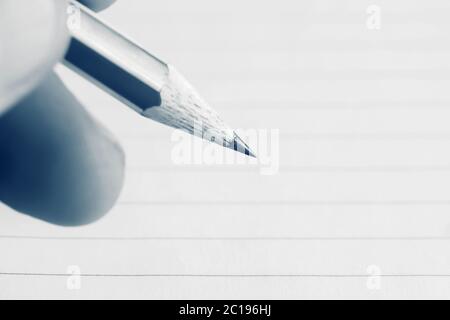 Male hand writing in notebook Stock Photo