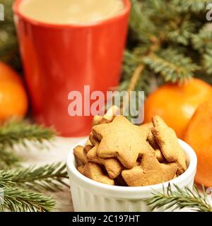 Gingerbread Cookie. Cup of coffee. Spruce branch. Orange tangerines Stock Photo