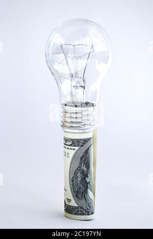 Money saved in different kinds of light bulbs, Lamps on the usd american dollar background Stock Photo