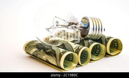 Money saved in different kinds of light bulbs, Lamps on the usd american dollar background Stock Photo