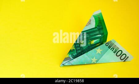 aircraft, One hundred euro plane isolated on yellow background, copy space for text Stock Photo