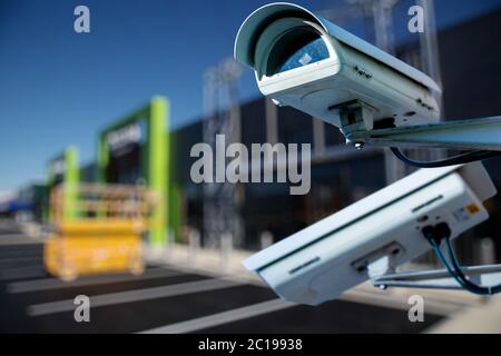 security CCTV camera or surveillance system with construction site on blurry background Stock Photo