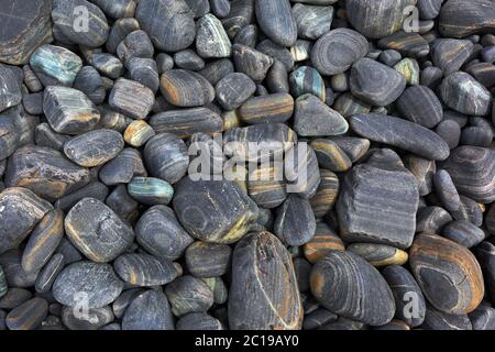Gray striped pebble background Stock Photo