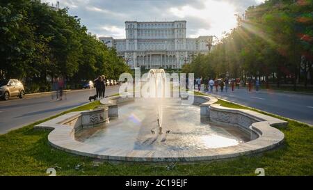 Bucharest, Romania - May 23, 2020: People walking in a car free zone during weekends, on Union Boulevard (Bulevardul Unirii), in front of Palace of th