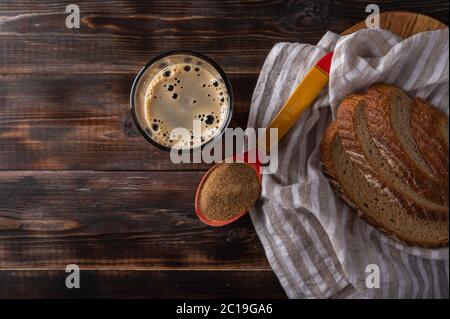 Top view homemade tradishional russian kvass in glass with foam and bread on napkin. Wonderful healthy refreshing drink for summer Stock Photo