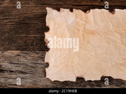 Old paper with the burned edges Stock Photo