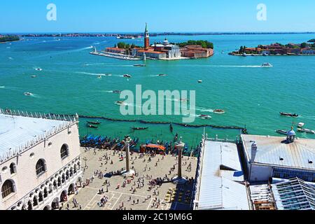 Panoramic aerial view of Venice lagoon with many tourist boats navigating,San Giorgio Maggiore island and Lido di Venezia in the distance,Italy Stock Photo