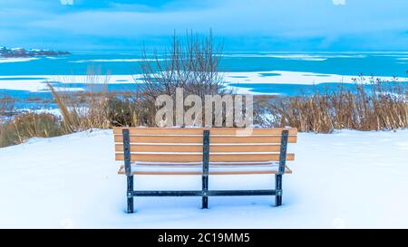 Bench Overlooking Semi Frozen Utah Lake With Overcast Sky Over The Horizon Stock Photo Alamy