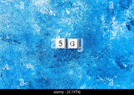 5G symbolon blue background. new technology. future technology. Stock Photo