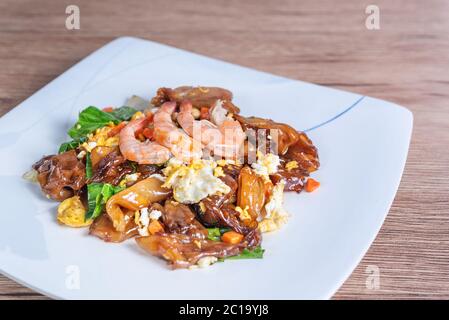 Stir fried wide rice noodles and  prawn with black soy sauce  (Pad See Ew) Stock Photo