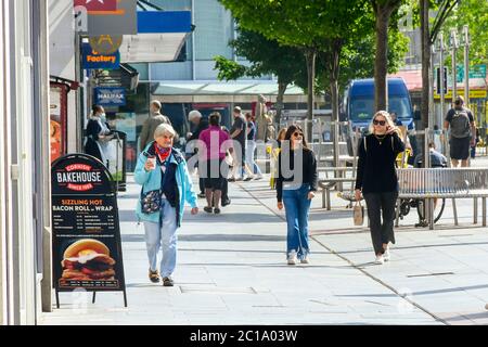 Exeter, Devon, UK.  15th June 2020.   Shops selling unessential items allowed to reopen today as coronavirus lockdown is eased further. Shoppers on the High Street at Exeter in Devon.  Picture Credit: Graham Hunt/Alamy Live News Stock Photo